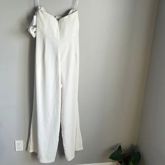 NEW Dessy Collection STRAPLESS NOTCH CREPE JUMPSUIT WITH POCKETS IN IVORY - Picture 3 of 10